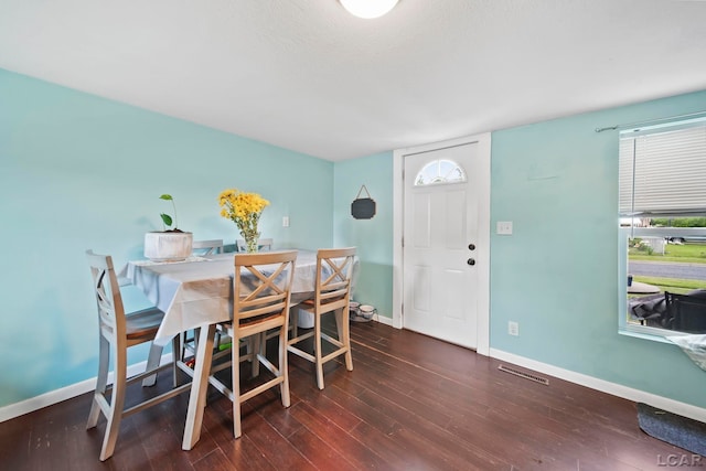 424 W Summit St, Adrian, MI 49221 - dining area with baseboards and wood finished floors