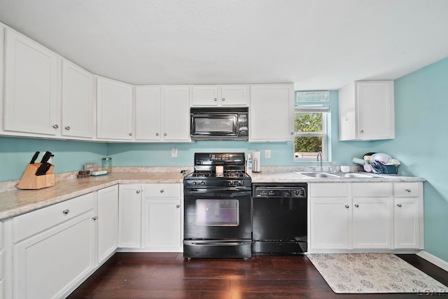 424 W Summit St, Adrian, MI 49221 - kitchen featuring black appliances, dark wood-style flooring, light countertops, and white cabinetry