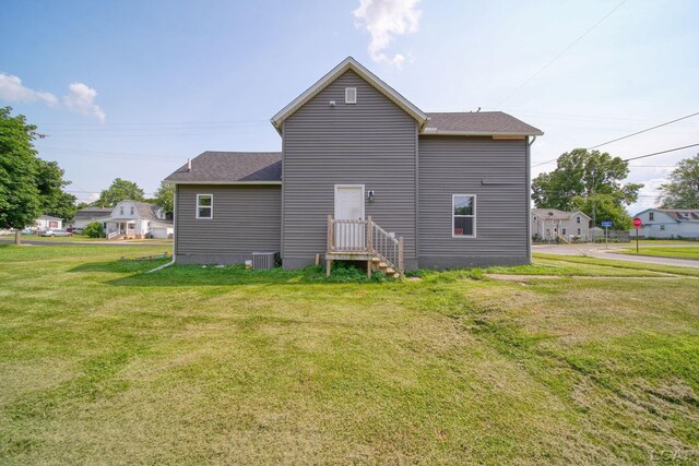 424 W Summit St, Adrian, MI 49221 - back of house with a yard and roof with shingles