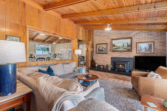 52 S Emerson Lake Dr, Branch, MI 49402 - living room featuring a wood ceiling with exposed beams, wood finished floors, and wooden walls