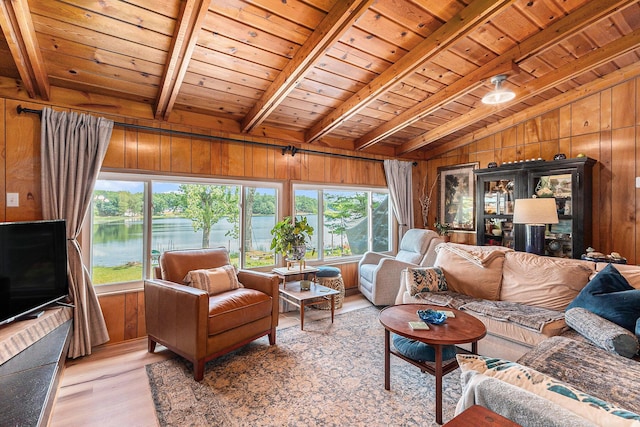 52 S Emerson Lake Dr, Branch, MI 49402 - living room with wood ceiling, wooden walls, light wood-type flooring, healthy amount of natural light, and a water view