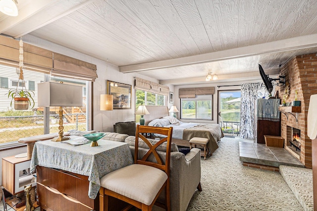 52 S Emerson Lake Dr, Branch, MI 49402 - carpeted bedroom featuring a wooden ceiling with exposed beams and a brick fireplace