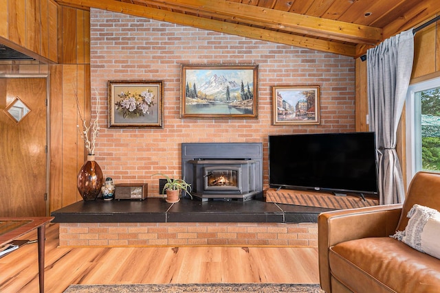 52 S Emerson Lake Dr, Branch, MI 49402 - living room with lofted ceiling, wood finished floors, wood ceiling, and a fireplace