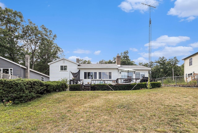 52 S Emerson Lake Dr, Branch, MI 49402 - back of property featuring a deck and a chimney