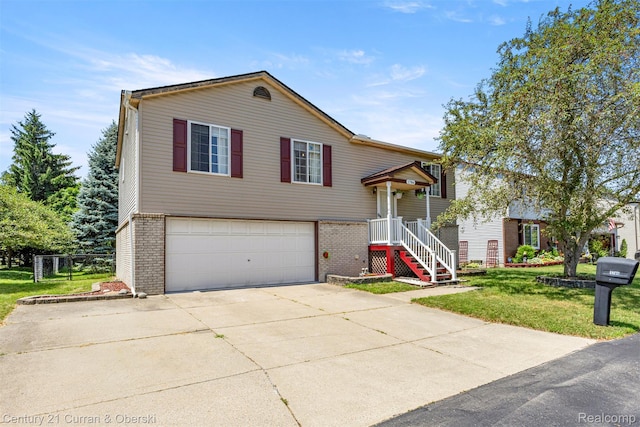 1786 Daisy Ln, Westland, MI 48186 - view of front of house with brick siding, a garage, concrete driveway, and a front lawn