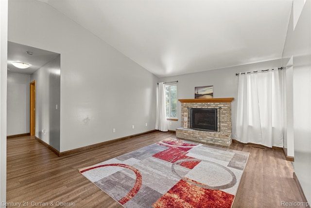 1786 Daisy Ln, Westland, MI 48186 - living room with wood finished floors, a brick fireplace, and lofted ceiling