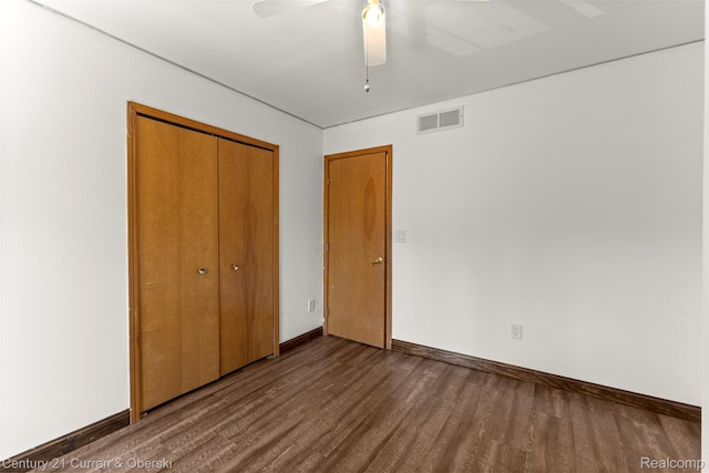1786 Daisy Ln, Westland, MI 48186 - unfurnished bedroom featuring dark wood-type flooring, a closet, and ceiling fan