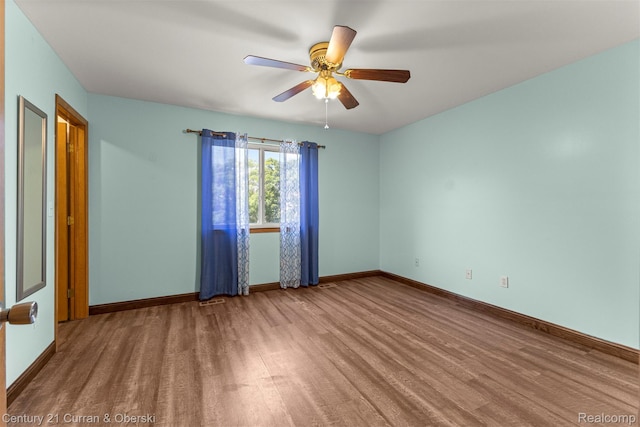 1786 Daisy Ln, Westland, MI 48186 - empty room with wood finished floors and a ceiling fan