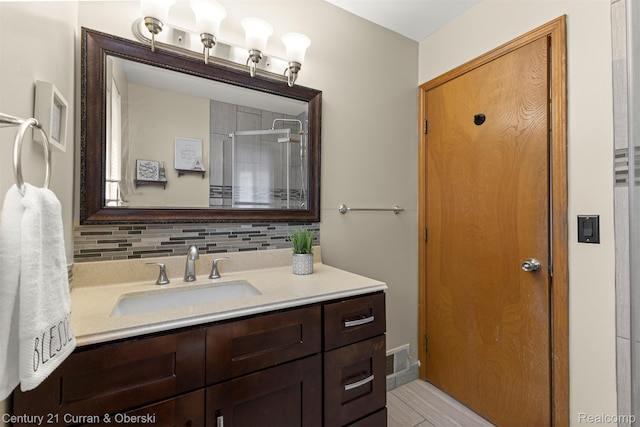 1786 Daisy Ln, Westland, MI 48186 - full bathroom featuring vanity, a shower, and tasteful backsplash
