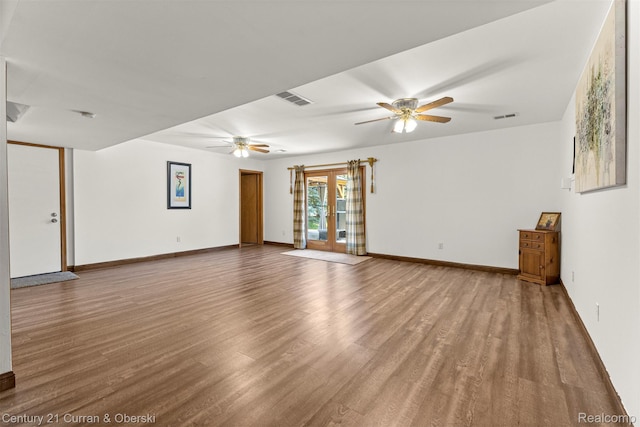 1786 Daisy Ln, Westland, MI 48186 - unfurnished living room featuring a ceiling fan and wood finished floors