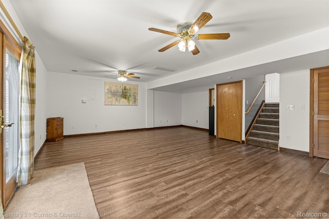 1786 Daisy Ln, Westland, MI 48186 - unfurnished living room featuring wood finished floors, stairs, and ceiling fan