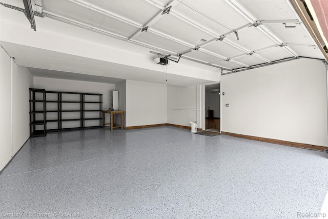 1786 Daisy Ln, Westland, MI 48186 - garage with a garage door opener and baseboards