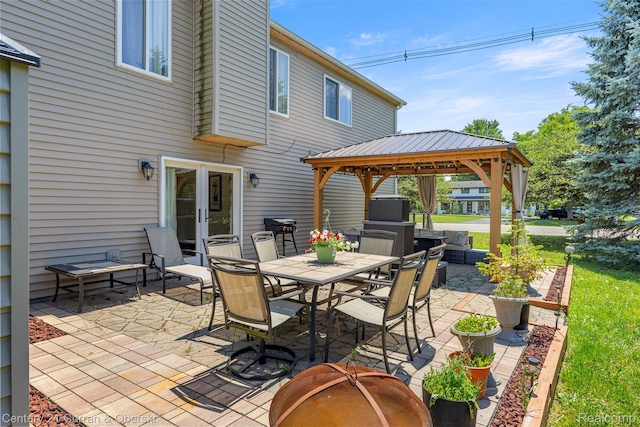 1786 Daisy Ln, Westland, MI 48186 - view of patio / terrace featuring a gazebo, outdoor dining space, and french doors
