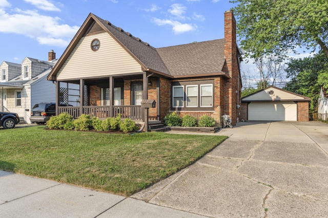 22358 Firwood Ave, Eastpointe, MI 48021 - view of front facade featuring covered porch, a garage, brick siding, an outdoor structure, and a front yard