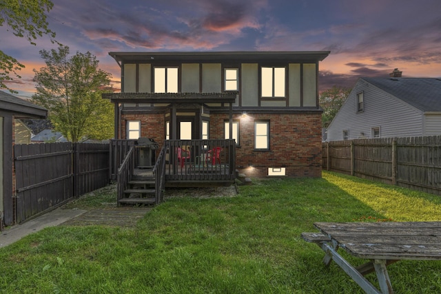 22358 Firwood Ave, Eastpointe, MI 48021 - back of property at dusk with a deck, brick siding, a fenced backyard, and a pergola