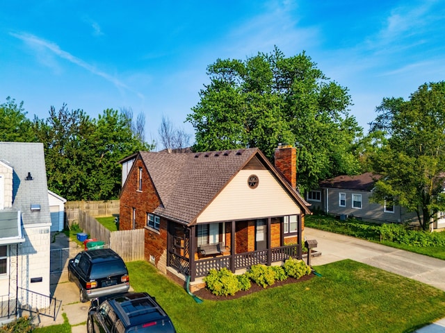 22358 Firwood Ave, Eastpointe, MI 48021 - view of front of property featuring a chimney, a porch, and brick siding