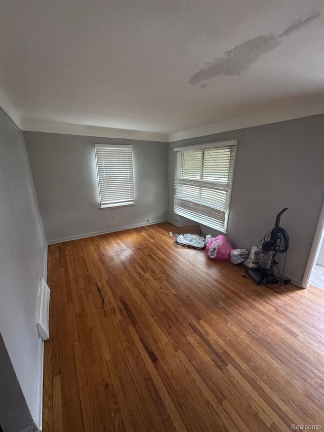 8116 Wyoming St, Detroit, MI 48204 - spare room with hardwood / wood-style flooring and baseboards