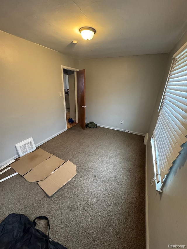 8116 Wyoming St, Detroit, MI 48204 - carpeted spare room with baseboards and a smoke detector