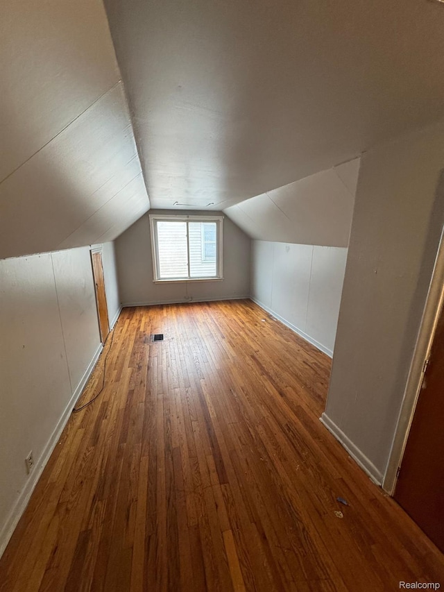 8116 Wyoming St, Detroit, MI 48204 - bonus room featuring wood-type flooring and vaulted ceiling
