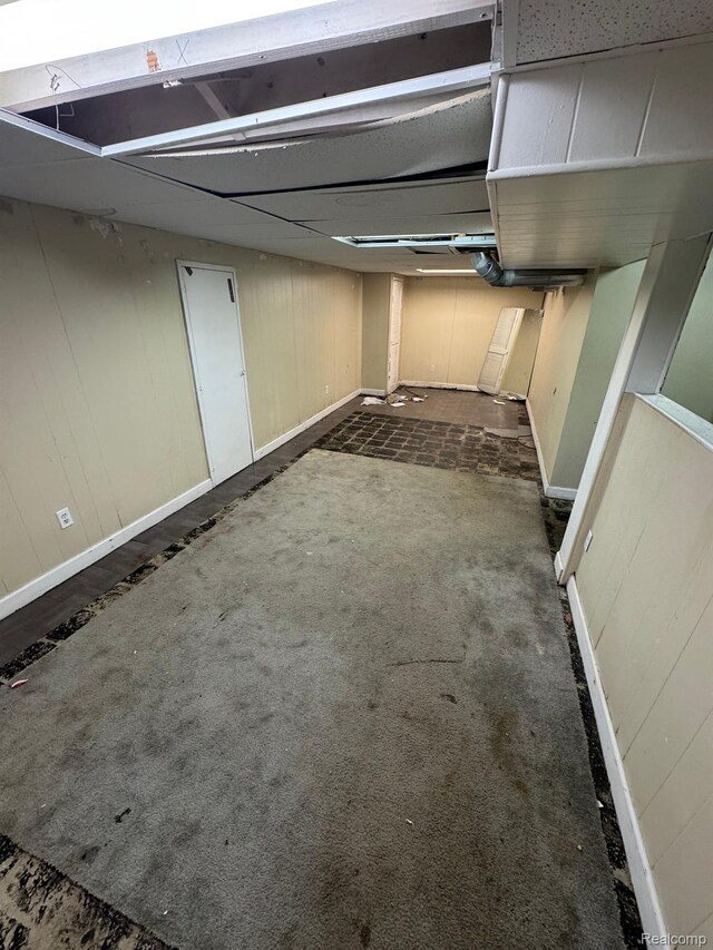 8116 Wyoming St, Detroit, MI 48204 - unfinished basement with baseboards and dark colored carpet