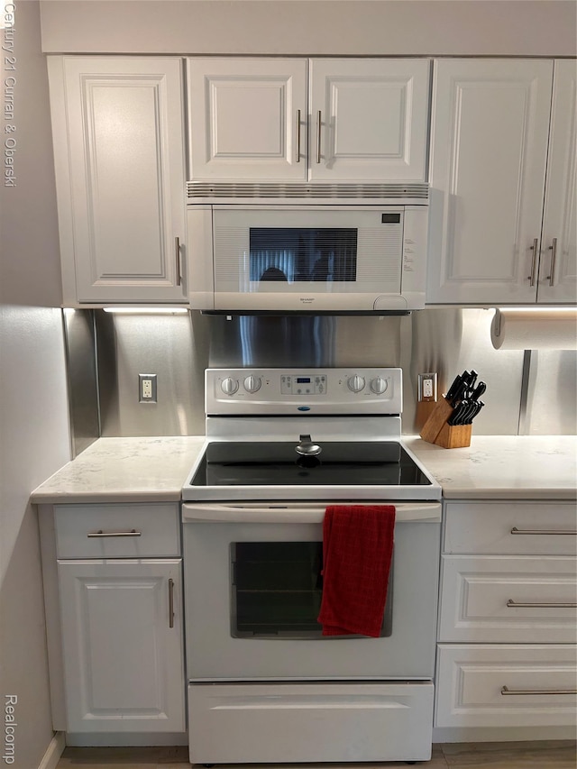 21800 Morley Ave Unit 607, Dearborn, MI 48124 - kitchen featuring white appliances and white cabinetry