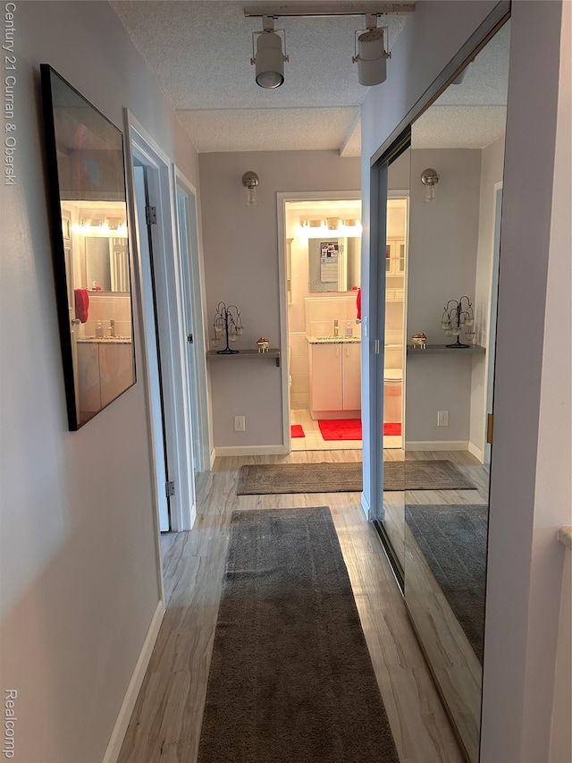 21800 Morley Ave Unit 607, Dearborn, MI 48124 - corridor with wood finished floors and a textured ceiling