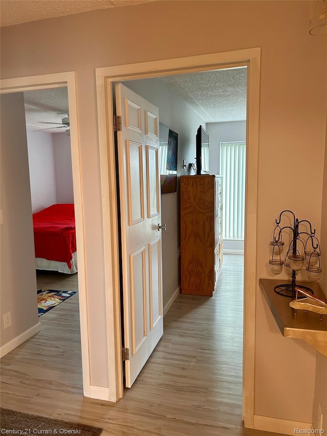 21800 Morley Ave Unit 607, Dearborn, MI 48124 - hall featuring a textured ceiling and wood finished floors