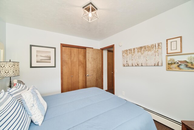 5015 Main St, Onekama, MI 49675 - bedroom with a closet and baseboard heating