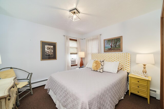 5015 Main St, Onekama, MI 49675 - carpeted bedroom with a baseboard heating unit and cooling unit