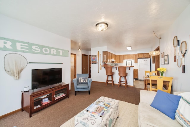 5015 Main St, Onekama, MI 49675 - living room featuring carpet and baseboards