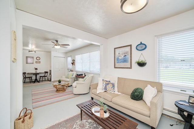 5015 Main St, Onekama, MI 49675 - living area with finished concrete floors and ceiling fan