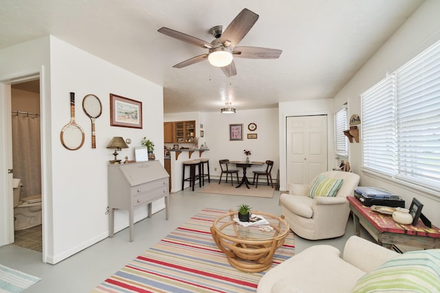 5015 Main St, Onekama, MI 49675 - living room featuring a ceiling fan