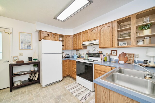 5015 Main St, Onekama, MI 49675 - kitchen featuring white appliances, open shelves, under cabinet range hood, light flooring, and brown cabinets