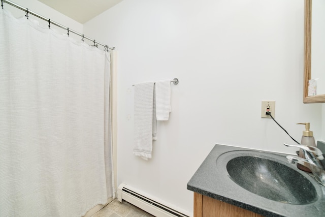 5015 Main St, Onekama, MI 49675 - bathroom with a baseboard heating unit, vanity, and a shower with shower curtain