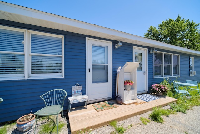 5015 Main St, Onekama, MI 49675 - doorway to property featuring a deck