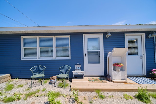 5015 Main St, Onekama, MI 49675 - doorway to property featuring a deck
