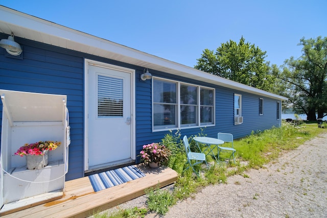 5015 Main St, Onekama, MI 49675 - view of side of property featuring cooling unit