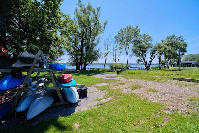 5015 Main St, Onekama, MI 49675 - view of green lawn featuring a water view