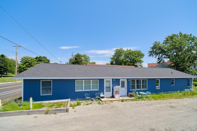 5015 Main St, Onekama, MI 49675 - ranch-style house with a shingled roof