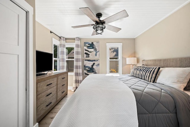 31326 Curran Beach Rd, Dowagiac, MI 49047 - bedroom featuring light wood-type flooring, a ceiling fan, and ornamental molding