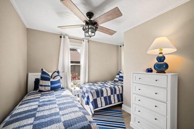 31326 Curran Beach Rd, Dowagiac, MI 49047 - bedroom with ornamental molding, a ceiling fan, and light wood-type flooring
