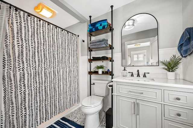 31326 Curran Beach Rd, Dowagiac, MI 49047 - bathroom with vanity, a shower with curtain, wainscoting, and tile walls