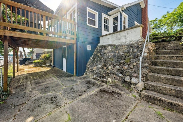 31326 Curran Beach Rd, Dowagiac, MI 49047 - view of side of home featuring stairs and a chimney