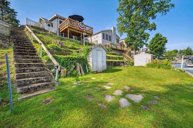 31326 Curran Beach Rd, Dowagiac, MI 49047 - view of green lawn with a shed, stairs, and a deck