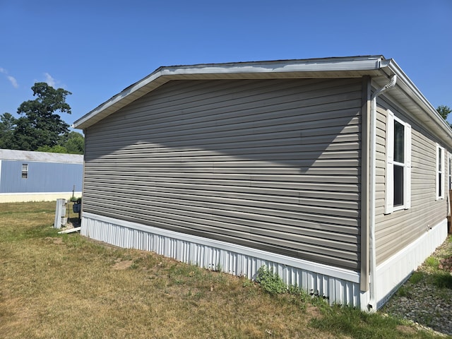 26 Traveler Dr Unit 26, Sparta, MI 49345 - view of side of home with a yard