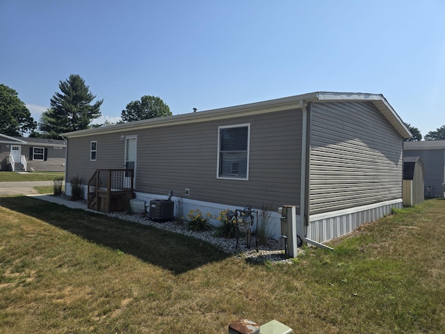 26 Traveler Dr Unit 26, Sparta, MI 49345 - rear view of house featuring a yard