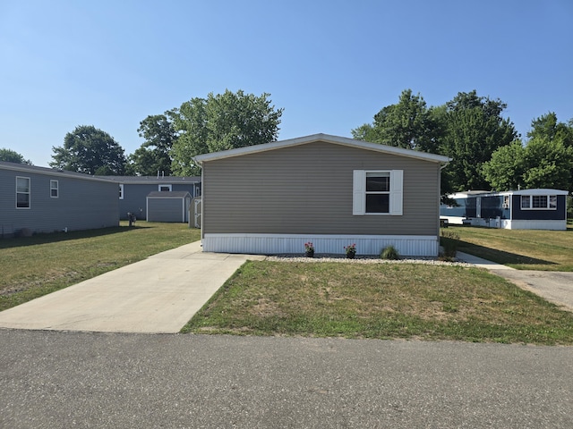 26 Traveler Dr Unit 26, Sparta, MI 49345 - view of property exterior featuring a yard