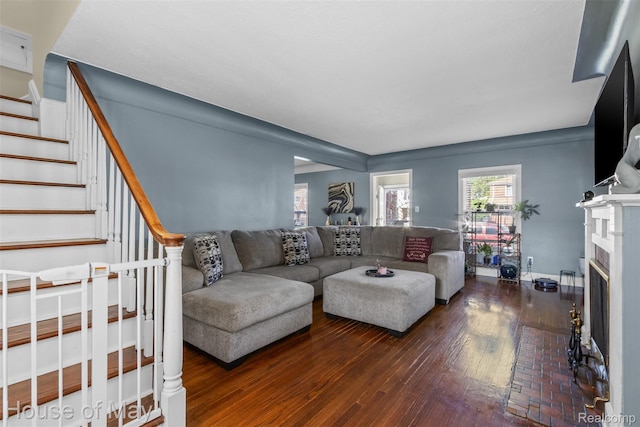 16842 Greenview Ave, Detroit, MI 48219 - living area featuring wood-type flooring, stairs, and a fireplace with flush hearth