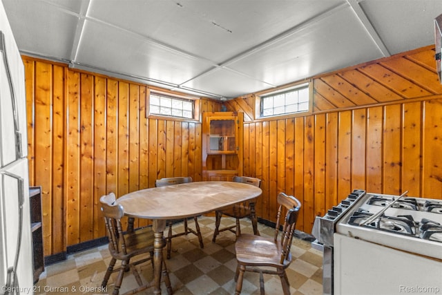 19163 Henry St, Melvindale, MI 48122 - dining area featuring tile patterned floors and wooden walls