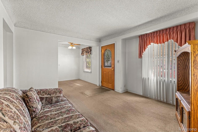 19163 Henry St, Melvindale, MI 48122 - living area featuring light carpet, a textured ceiling, and a ceiling fan